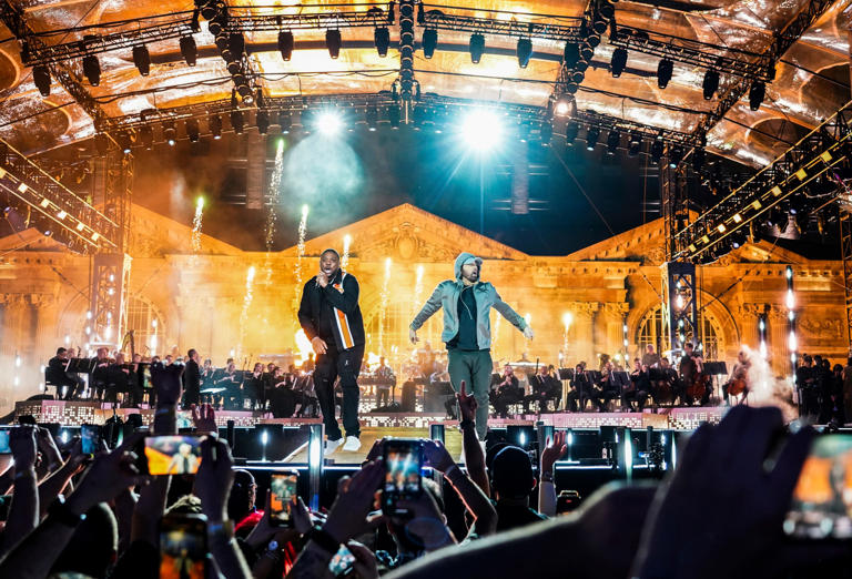 Eminem and Denaun Porter perform on stage during the "Live From Detroit: The Concert at Michigan Central" at Roosevelt Park in front of the Michigan Central Station in Detroit's Corktown neighborhood on Thursday, June 6, 2024.