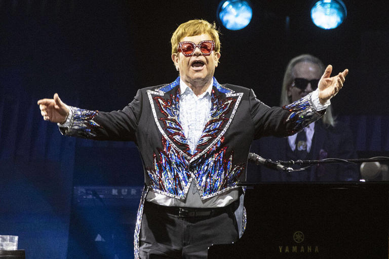 Elton John acknowledges the crowed during his ''Farewell Yellow Brick Road,'' final tour at Allegiant Stadium, on Tuesday, Nov. 1, 2022, in Las Vegas. (Bizuayehu Tesfaye Las Vegas Review-Journal) @btesfaye