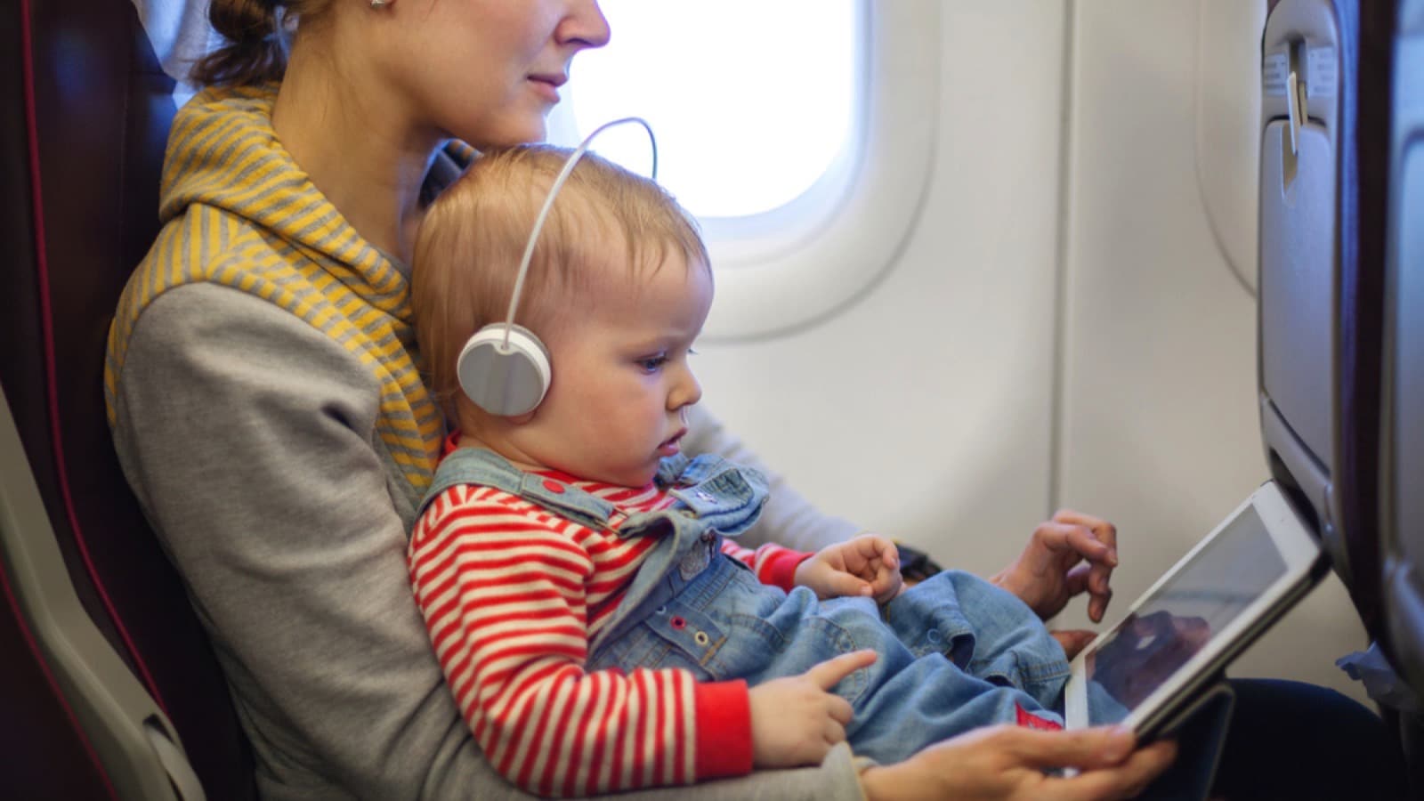 <p>Talk to your child's doctor about any suggestions for decongestion on the plane. A decent decongestant will be highly effective if administered before you reach great altitudes; it is suitable for pain management, not just for when they are sick.</p>