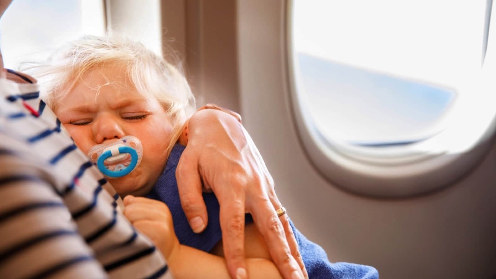 <p>With the other adult passengers in mind, many suggest avoiding overnight flights if you are flying with a toddler. Unfortunately, many make the mistake of assuming their little ones will sleep through the entire plane ride.</p><p>They don't; the plane is dark, so you are exhausted, and the baby won't stop crying. But, on the other hand, your kiddo won't remember anything before the age of six anyway, so don't worry if the plane ride is a nightmare.</p>