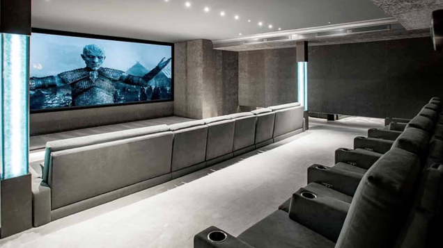 The only thing missing from this indoor home theater is a giant tub of popcorn.