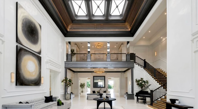 When you enter the home, you are greeted by a huge foyer with high ceilings. The gorgeous skylight helps create a bright open space.