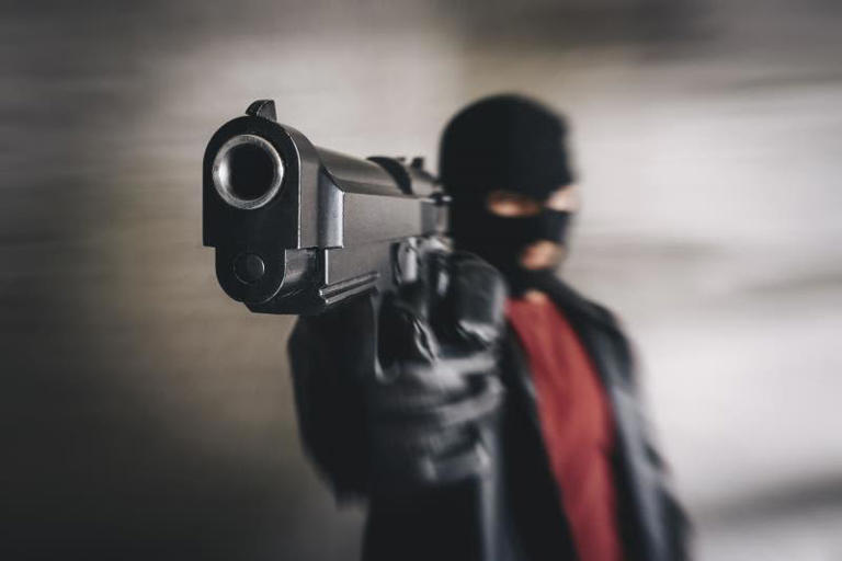 An armed man in a mask began firing blanks in front of students. ©Getty Images/Diy13
