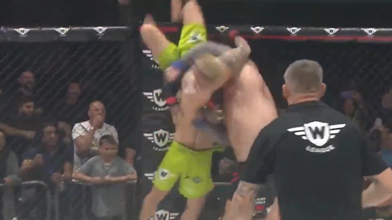 Video! Strongman Delivers Insane Powerbomb, One-Punch KO In 2v1 Fight