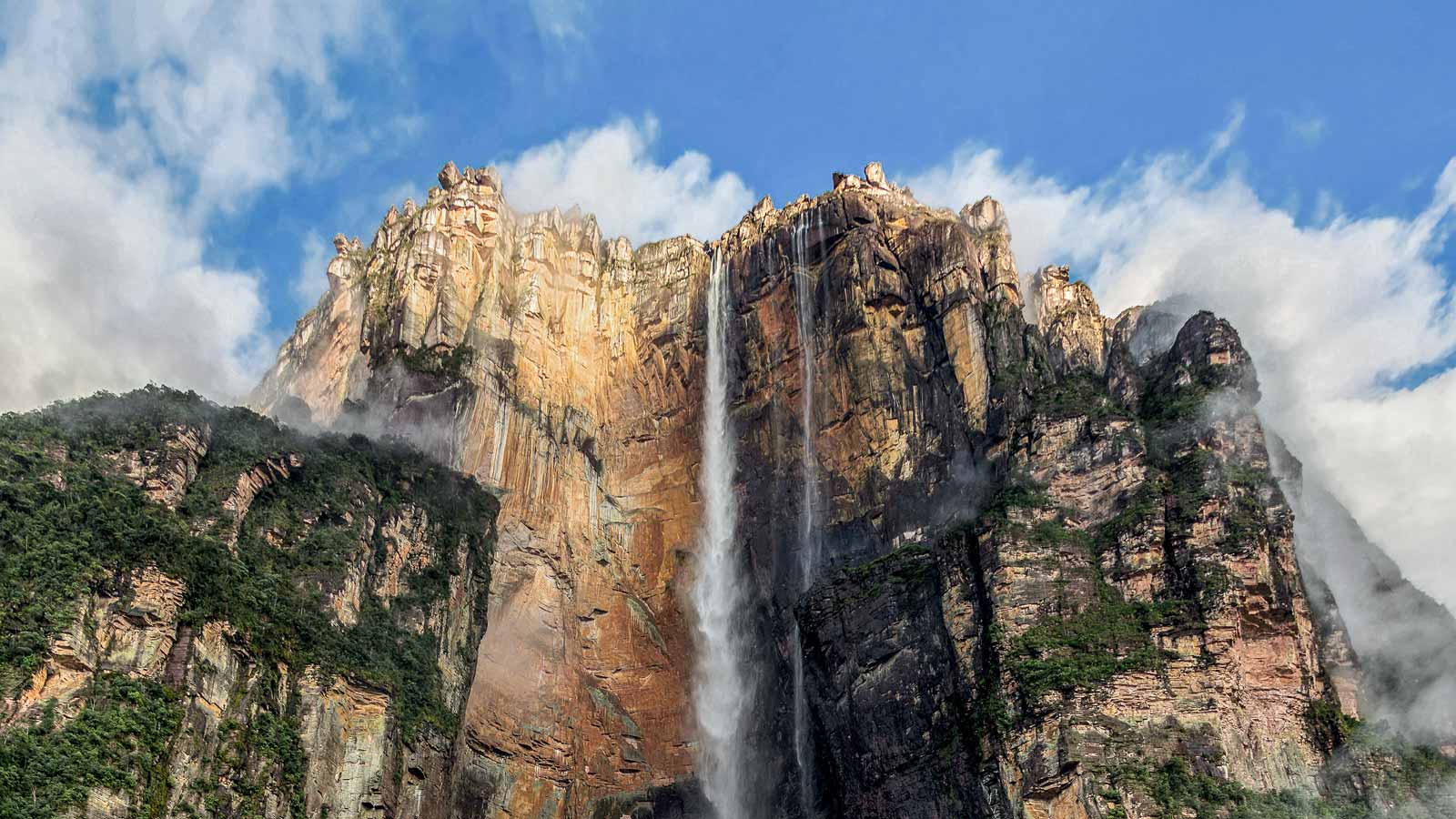 <p><span>Angel Falls is Venezuela’s highest waterfall, at 3,212 feet—15 times taller than Niagara Falls. The water from the Churun River plunges freely over a mountain edge into whitewater rapids below, followed by a second 30-meter drop.</span></p><p><span>Reaching the falls is an adventure in itself. First, take a small plane to the town of Canaima, followed by a one-day boat ride to the falls, and you’ll finally arrive at what can only be described as heaven.</span></p>