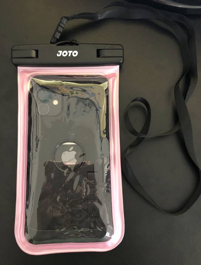 phone inside of a pink case with a lanyard