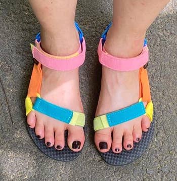 Reviewer's feet in the multicolored sandals