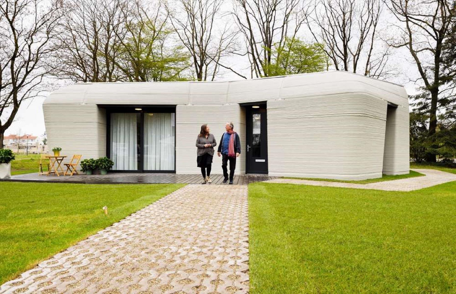 <p>The first Project Milestone home was built and occupied in April 2021, making it the first inhabited 3D-printed home in Europe. Located in a suburb of the city of Eindhoven, the single-story home is the first of five homes that will be printed in the neighborhood. Tenants Elize Lutz and Harrie Dekkers are already renting out the unique property.</p>