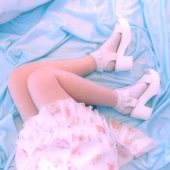 reviewer wearing the sandals in white