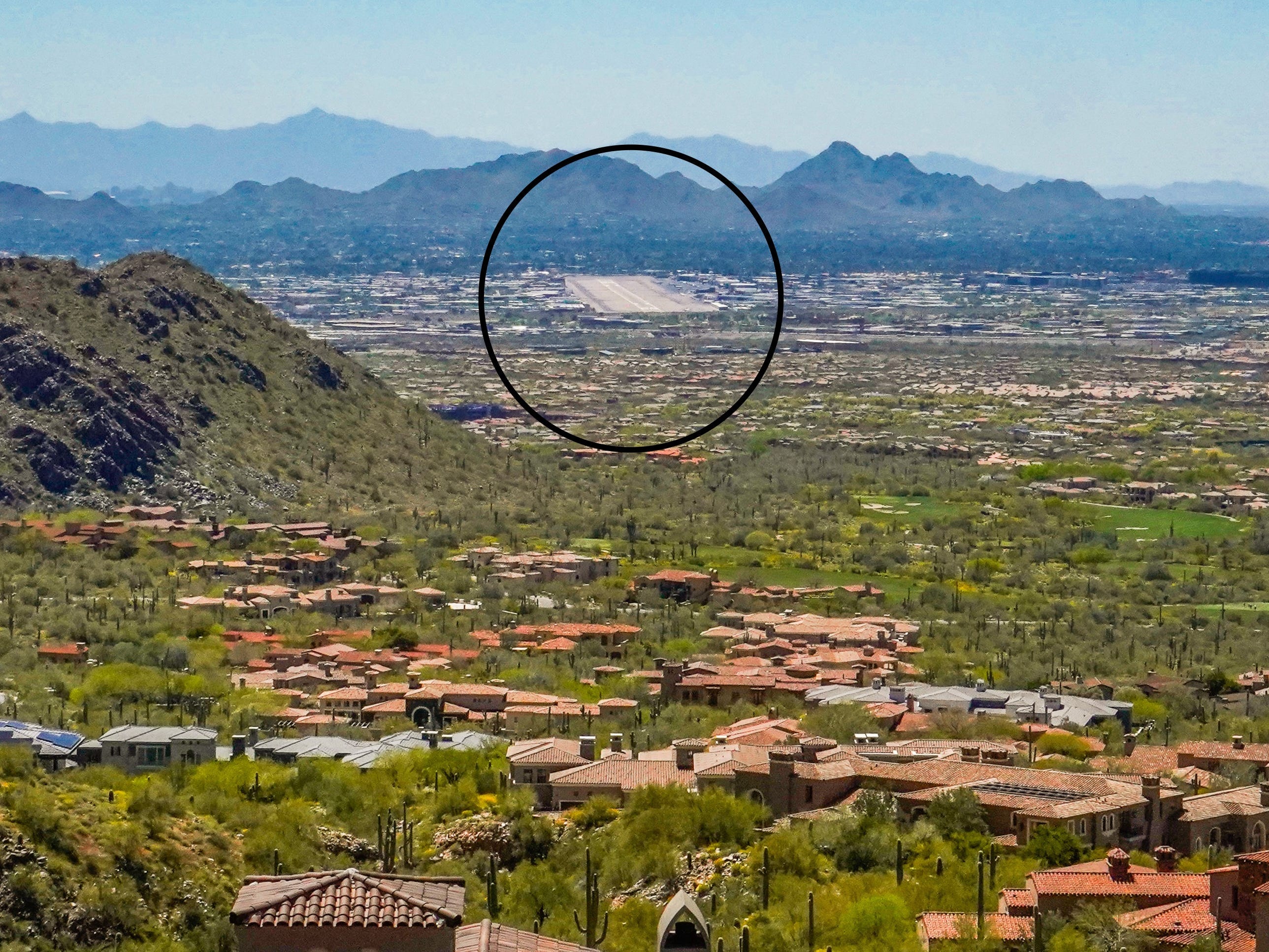 <p>I had a view of the city at the top of DC Ranch in Silverleaf. </p><p>Dankert pointed out that the large tarmac in the distance was Scottsdale Airport, one of the most popular places in the US for the <a href="https://www.businessinsider.com/most-popular-airports-private-jets-pj-jet-tracking-list-2023-12">ultrawealthy to park their private jets</a>.</p><p>Shackelton said many of her clients move to DC Ranch to be close to their personal aircraft, which is only 20 minutes away.</p>