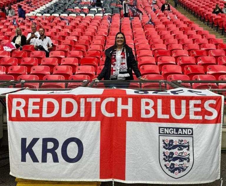 Lynda Courts, who runs Redditch Blues, was pictured with the flag on Friday before it disappeared later