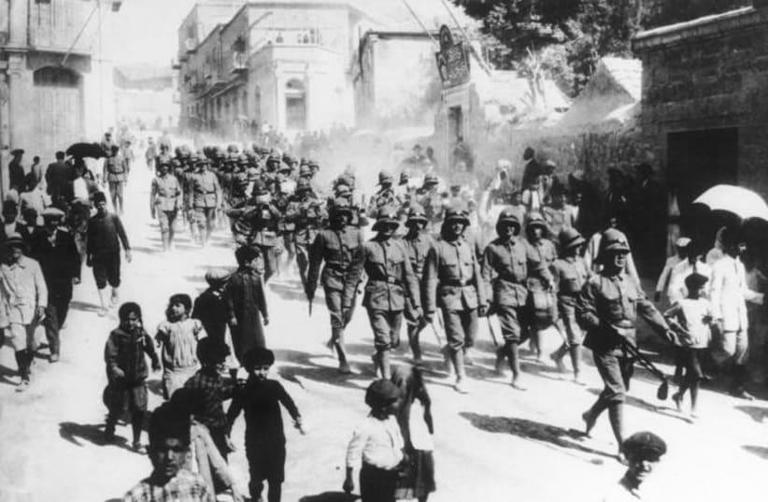  GERMAN SOLDIERS march through Jerusalem, c. 1916-1917. 