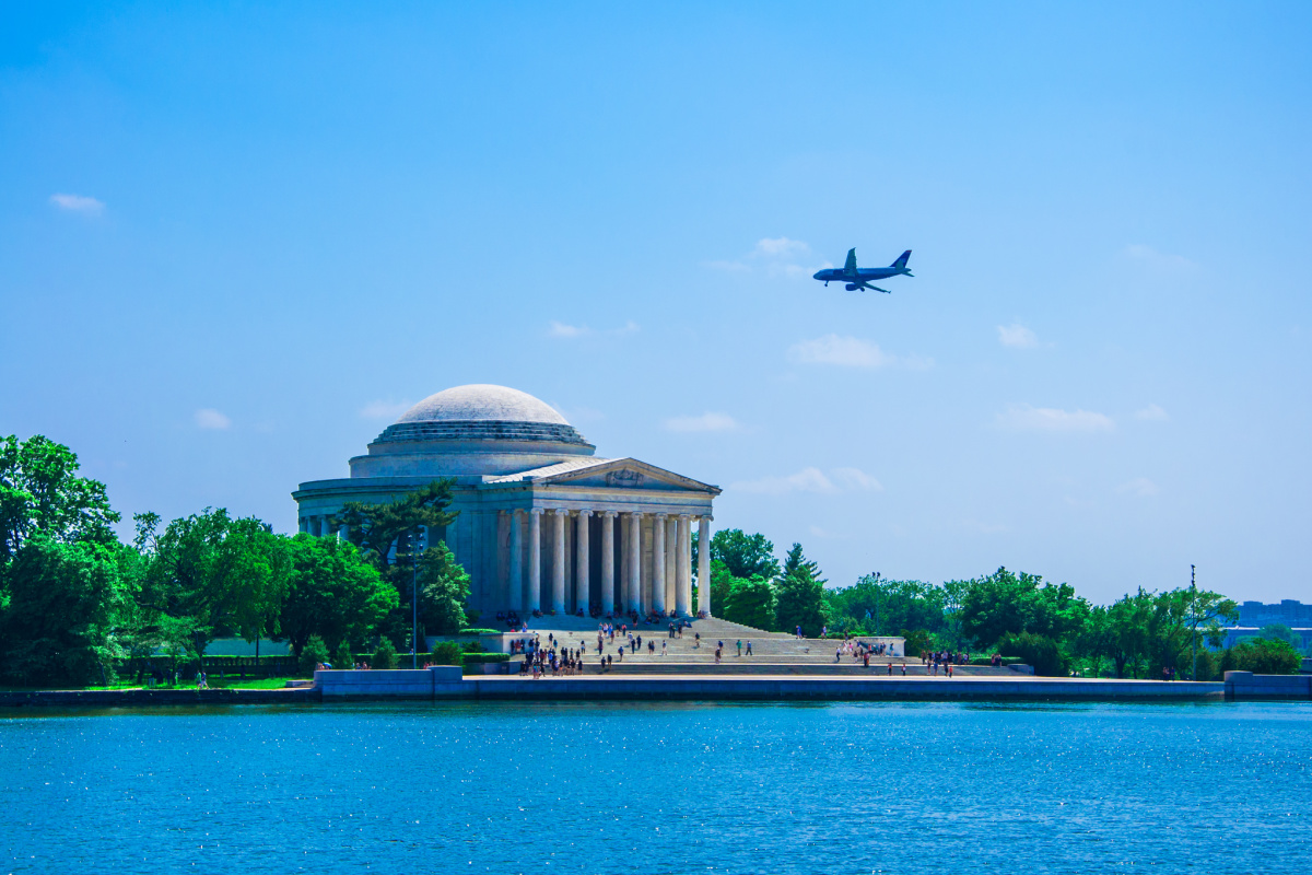 Plane flying over Jefferson Memorial