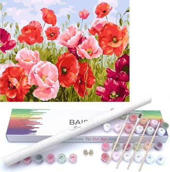 water color painting on pink and red peonies next to a watercolor set