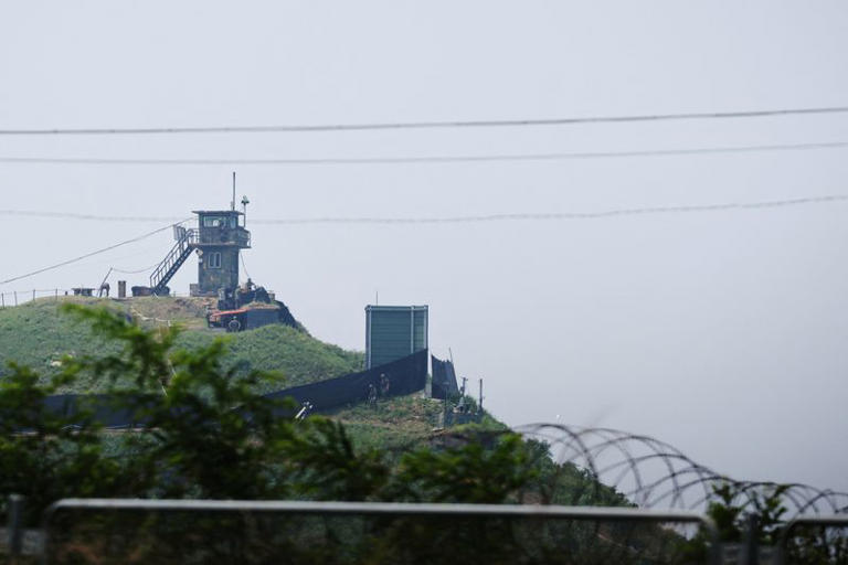 South Korean soldiers walk past a military facility (Green box) where loudspeakers dismantled in 2018 used to be, near the demilitarized zone separating the two Koreas in Paju, South Korea, June 10, 2024.  REUTERS/Kim Hong-Ji