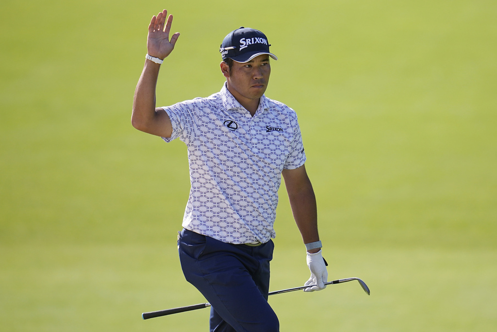 <p>Hideki Matsuyama waves after his shot from the bunker went into the cup on the 18th green the first round of the Memorial golf tournament Thursday, June 6, 2024, in Dublin, Ohio. </p>