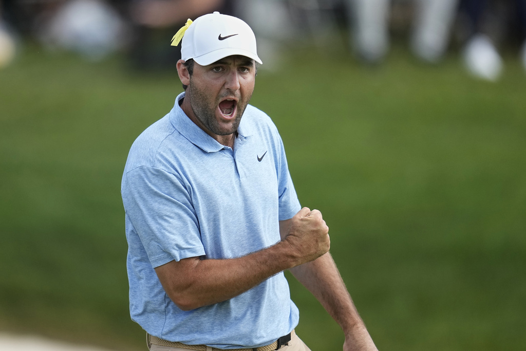 <p>Scottie Scheffler pumps his fist after sinking a putt on the 18th green to win the Memorial golf tournament, Sunday, June 9, 2024, in Dublin, Ohio. </p>