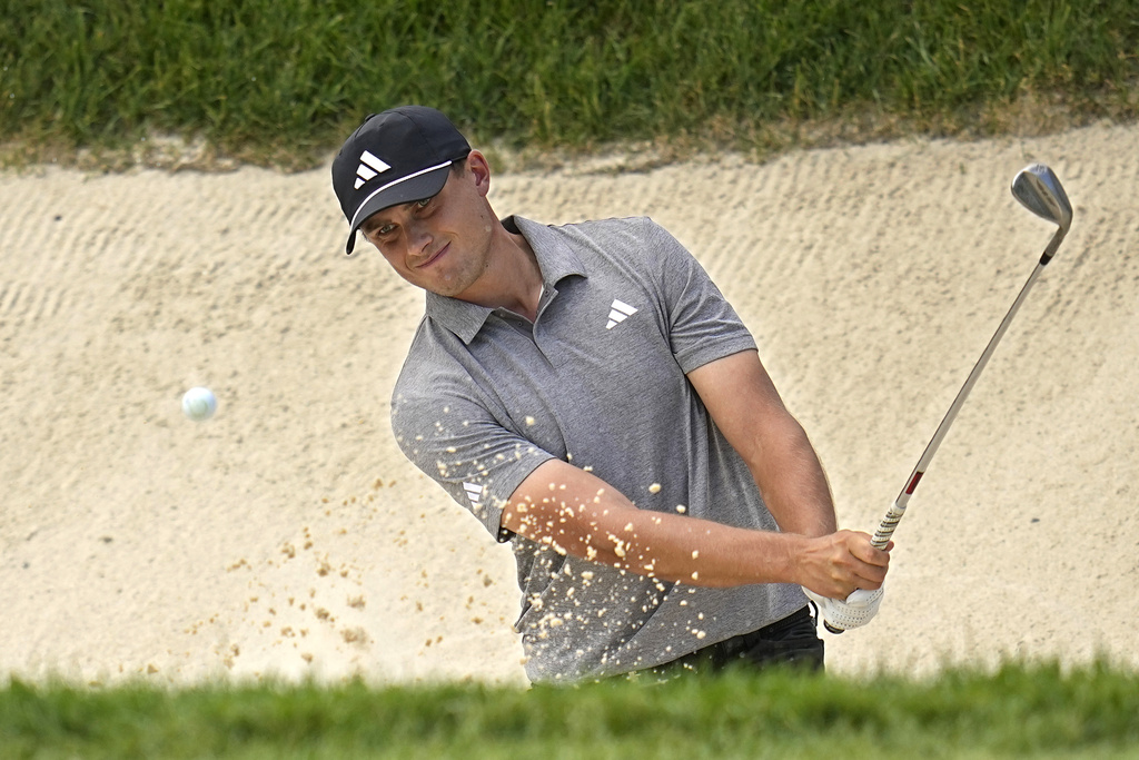 <p>Ludvig Aberg hits from a bunker onto the 17th green during the third round of the Memorial golf tournament, Saturday, June 8, 2024, in Dublin, Ohio. </p>