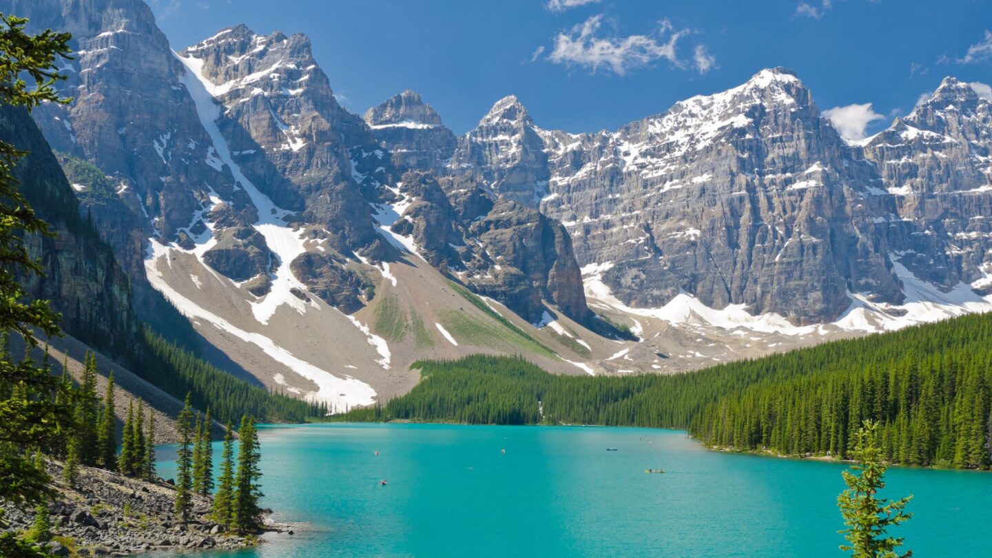 <p>Banff National Park in Canada is purely magical. Picture the vibrant turquoise waters of Lake Louise, surrounded by snow-capped mountains. The scenery is straight from a fairytale, with lush forests and sweeping mountain views. These photos can transfer you away to a peaceful, natural paradise, even if it’s just for a moment during your hectic workday.</p>