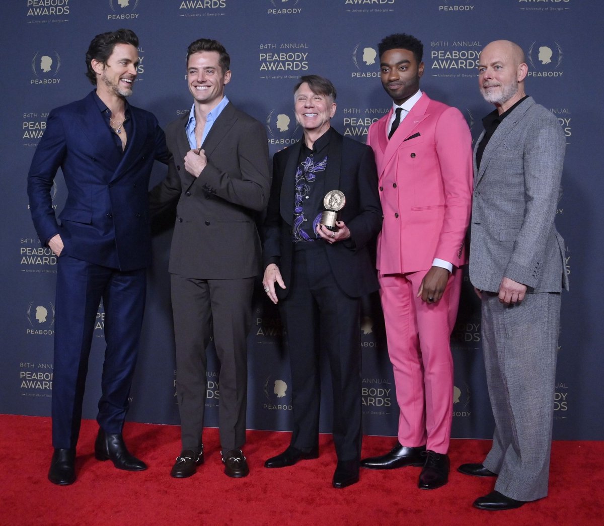 <p>Left t right, Matt Bomer, Robbie Rogers, Ron Nyswaner, Jelani Alladin and Daniel Minahan pose with their Entertainment award for "Fellow Travelers." Photo by Jim Ruymen/UPI</p>