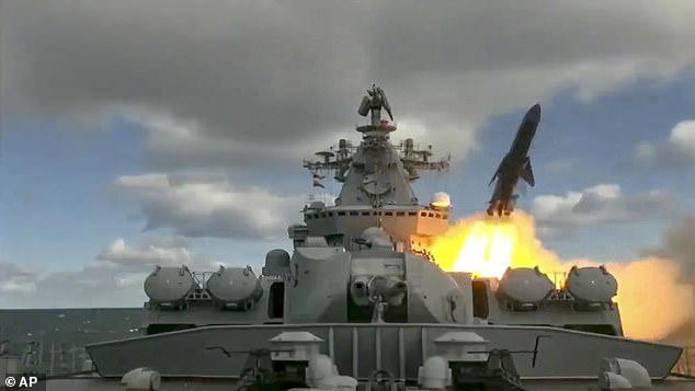 In this undated video grab provided by Russian Defence Ministry Press Service, Russia's Varyag missile cruiser fires a rocket in naval drills