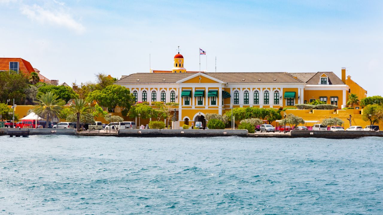 <p>Curaçao is dotted with historic <em>landhuizen</em>, colorful and significant as the main houses of former plantations that once covered the island. While there used to be hundreds of these impressive houses, only about sixty remain today. Landhuis Chobolobo, the most famous, is now home to Blue Curaçao liquor, offering tours of the distillery and the historic property. Landhuis Knip, near the twin beaches, was the site of the 1795 slave revolt and now serves as a museum, while Landhuis Jan Kok, a former salt plantation, is an art gallery perfect for a cultural stop on your way to the beach.</p>