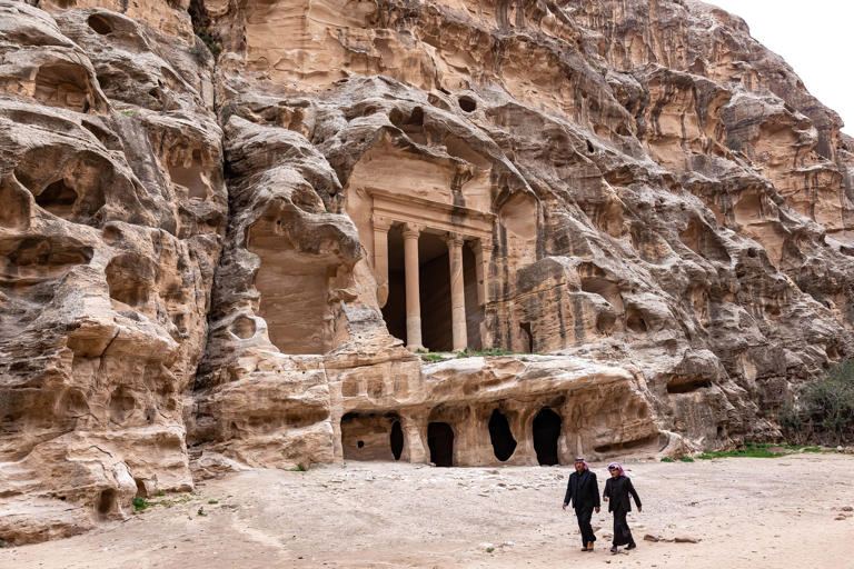 Photo of tourists walking in Petra, Jordan. 