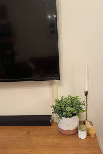 An up close shot of a BuzzFeeder's TV with the beige cord cover