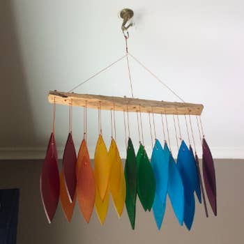 reviewer hanging the piece on their ceiling