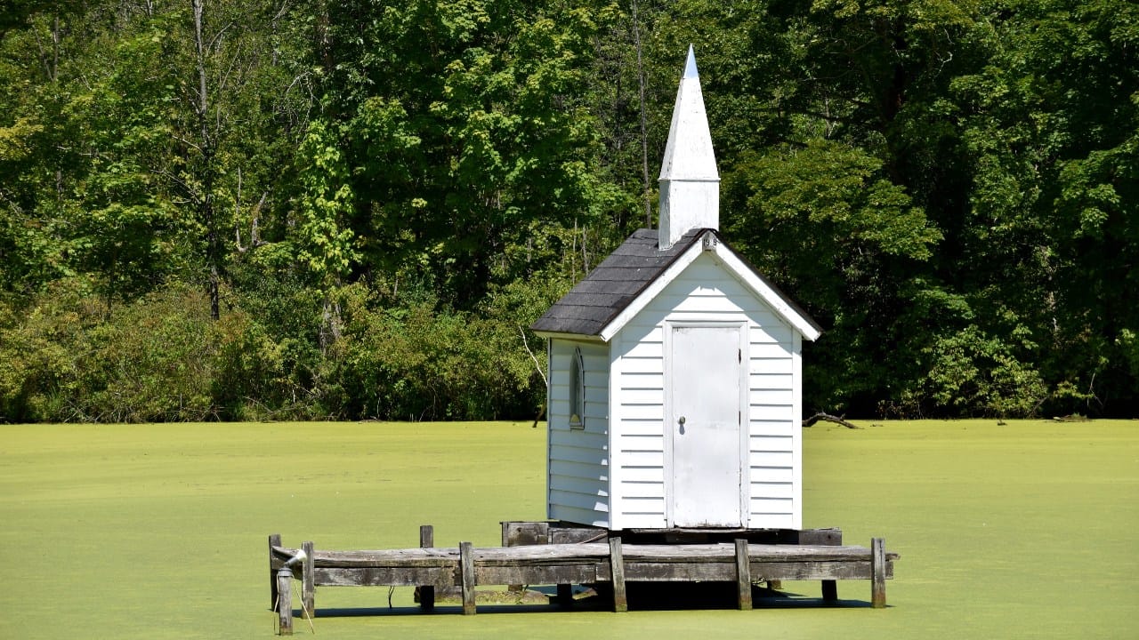 <p>Not only is it one of the smallest churches in the world (it’s about large enough to fit three people inside), but it’s also floating in the middle of a pond.</p><p>The <a href="https://www.atlasobscura.com/places/cross-island-chapel-the-world-s-smallest-church" rel="noopener">tiny white chapel</a> was built in 1989 and floats along the luscious pond—making it one of the most unique churches. </p><p>It has under 30 square feet of space inside and is one of the weirdest road trip attractions near the Big Apple.</p>