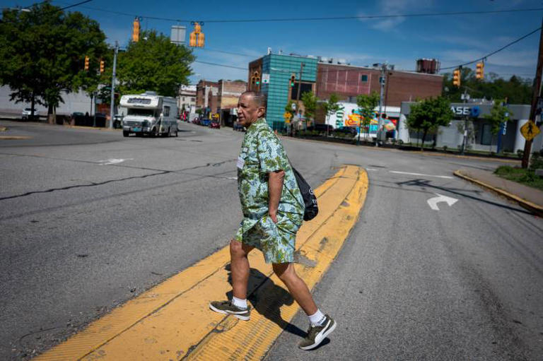 Jerome Maynor, a street outreach worker for Central Outreach Wellness Center, walks through McKees Rocks in search of people who need harm-reduction supplies on May 1. Maynor has reversed a dozen overdoses while on his rounds. (Photo by Stephanie Strasburg/PublicSource)