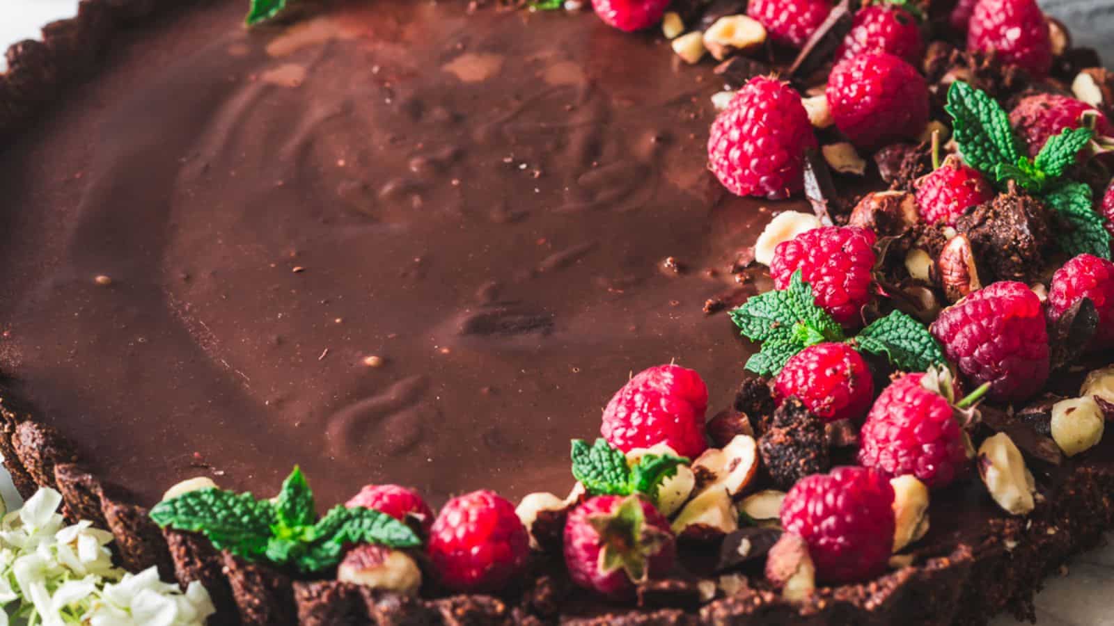 <p>The Chocolate Raspberry Tart marries the bold flavors of chocolate with the zesty taste of raspberries. In about 1 hour, you can create this dessert featuring a chocolate crust and a smooth ganache filling. Its luxurious taste profile makes it a memorable centerpiece for a graduation celebration.<br><strong>Get the Recipe: </strong><a href="https://immigrantstable.com/chocolate-raspberry-tart/?utm_source=msn&utm_medium=page&utm_campaign=17%20classic%20graduation%20cakes%20you%20wish%20you%20had%20in%20high%20school%20">Chocolate Raspberry Tart</a></p>