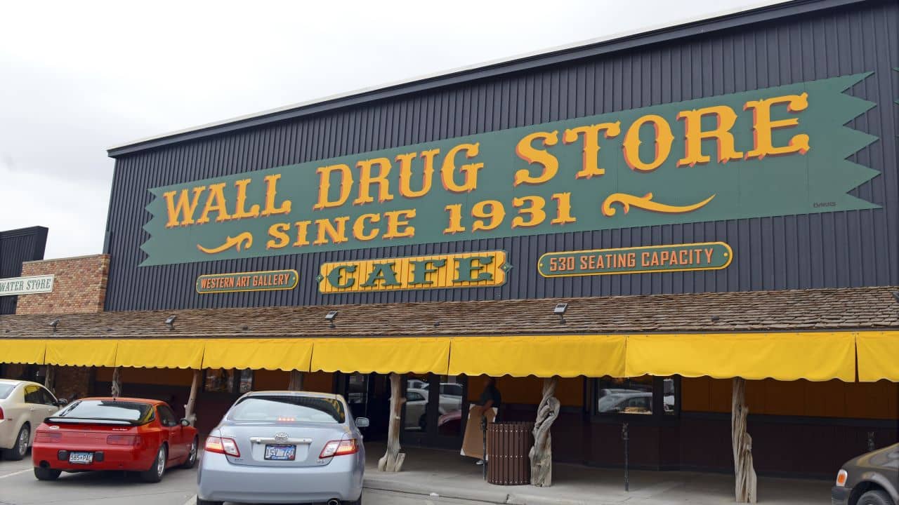 <p>The Wall Drug Store began as a pit stop for travelers to enjoy free ice water, and today, it’s a popular roadside stop that <a href="https://www.walldrug.com/about-us" rel="noopener">attracts 2 million visitors annually.</a></p><p>You’ll find plenty of unique trinkets and souvenirs, delicious homemade treats, and a fresh glass of ice-cold water here. The store is an iconic stop with years of history behind it that’s worth seeing if you’re in the area. </p>