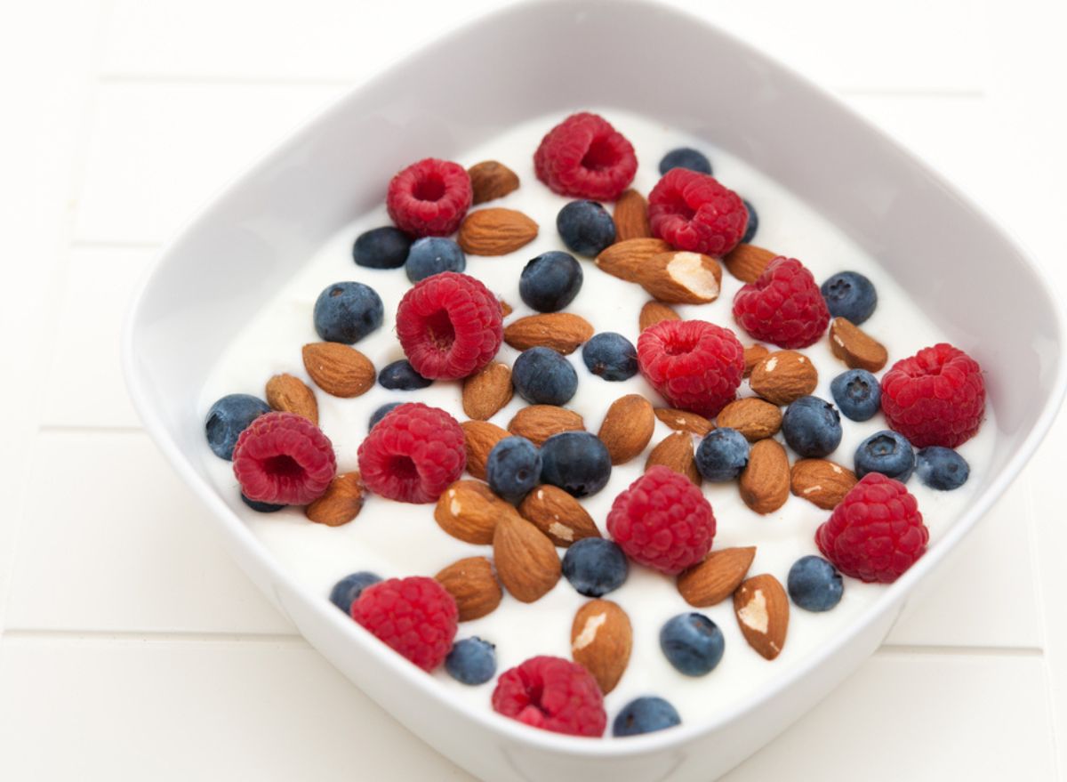 <p><strong>Breakfast: 22 grams</strong></p><p><ul><p>  <li><a rel="noopener noreferrer external nofollow" href="https://usa.fage/products/yogurt/fage-total-0">Fage 0% Greek Yogurt</a> (3/4 cup)</li></p><p>  <li>Chia seeds (1 teaspoon)</li></p><p>  <li>Frozen mixed berries</li></p><p>  <li>Almonds (1/2 ounce)</li></p><p>  <li>To make sure the chia seeds get soft enough, I usually try to put them in a jar with the yogurt the night before, and place them in the fridge until I'm ready to eat.</li></p></ul></p><p><strong>Lunch: 35 grams</strong></p><p><ul><p>  <li><a rel="noopener noreferrer external nofollow" href="https://ithacahummus.com/">Lemon Dill Ithaca Hummus</a> (2 tablespoons)</li></p><p>  <li>Chicken breast (3 ounces)</li></p><p>  <li>Quinoa (1 cup, cooked)</li></p><p>  <li>Chopped cucumber and tomatoes</li></p><p>  <li><a rel="nofollow noopener noreferrer external" href="https://usa.fage/products/yogurt/fage-total-0">Fage 0% Greek Yogurt</a> mixed with lemon juice and dill</li></p></ul></p><p><strong>Snack: 13 grams</strong></p><p><ul><p>  <li><a rel="noopener noreferrer external nofollow" href="https://www.questnutrition.com/collections/frosted-cookies/products/birthday-cake-frosted-cookies-twin-pack">Quest Frosted Protein Cookies-Birthday Cake</a></li></p><p>  <li>Almonds (1/2 ounce)</li></p></ul></p><p><strong>Dinner: 32 grams</strong></p><p><ul><p>  <li><a rel="nofollow noopener noreferrer external" href="https://www.eatbanza.com/products/bucatini">Banza Bucatini Chickpea Pasta</a></li></p><p>  <li>Salmon (3 ounces)</li></p><p>  <li>Sauteed vegetables (mushrooms, eggplant, and zucchini)</li></p></ul></p><p><strong>RELATED:</strong> <a rel="noopener noreferrer external nofollow" href="https://www.eatthis.com/best-protein-bars/">The 16 Healthiest Low-Sugar Protein Bars</a></p>