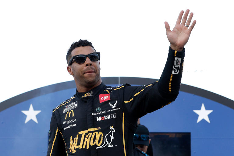 NORTH WILKESBORO, NORTH CAROLINA - MAY 19: Bubba Wallace, driver of the #23 Alltroo Toyota, waves to fans as he walks onstage during driver intros prior to the NASCAR Cup Series All-Star Race at North Wilkesboro Speedway on May 19, 2024 in North Wilkesboro, North Carolina. (Photo by Sean Gardner/Getty Images)