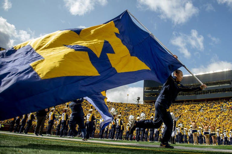 The Michigan flag is raced out onto the field before the first half as No. 5 University of Michigan football faces off against No. 10 Penn State on Saturday, Oct. 15, 2022 in Ann Arbor.