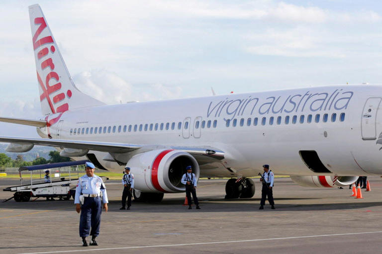 A man ran naked through a Virgin Australia aircraft on Monday night.