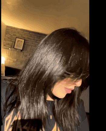 GIF of reviewer shaking their long, shiny hair