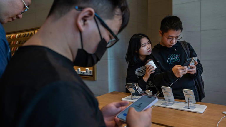 People browsing the iPhone 15 at a flagship store in Beijing on September 22, 2023