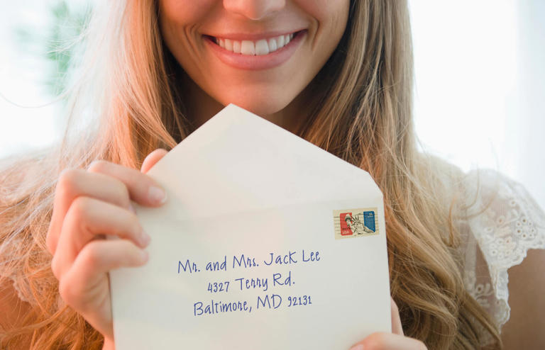 woman holding envelope
