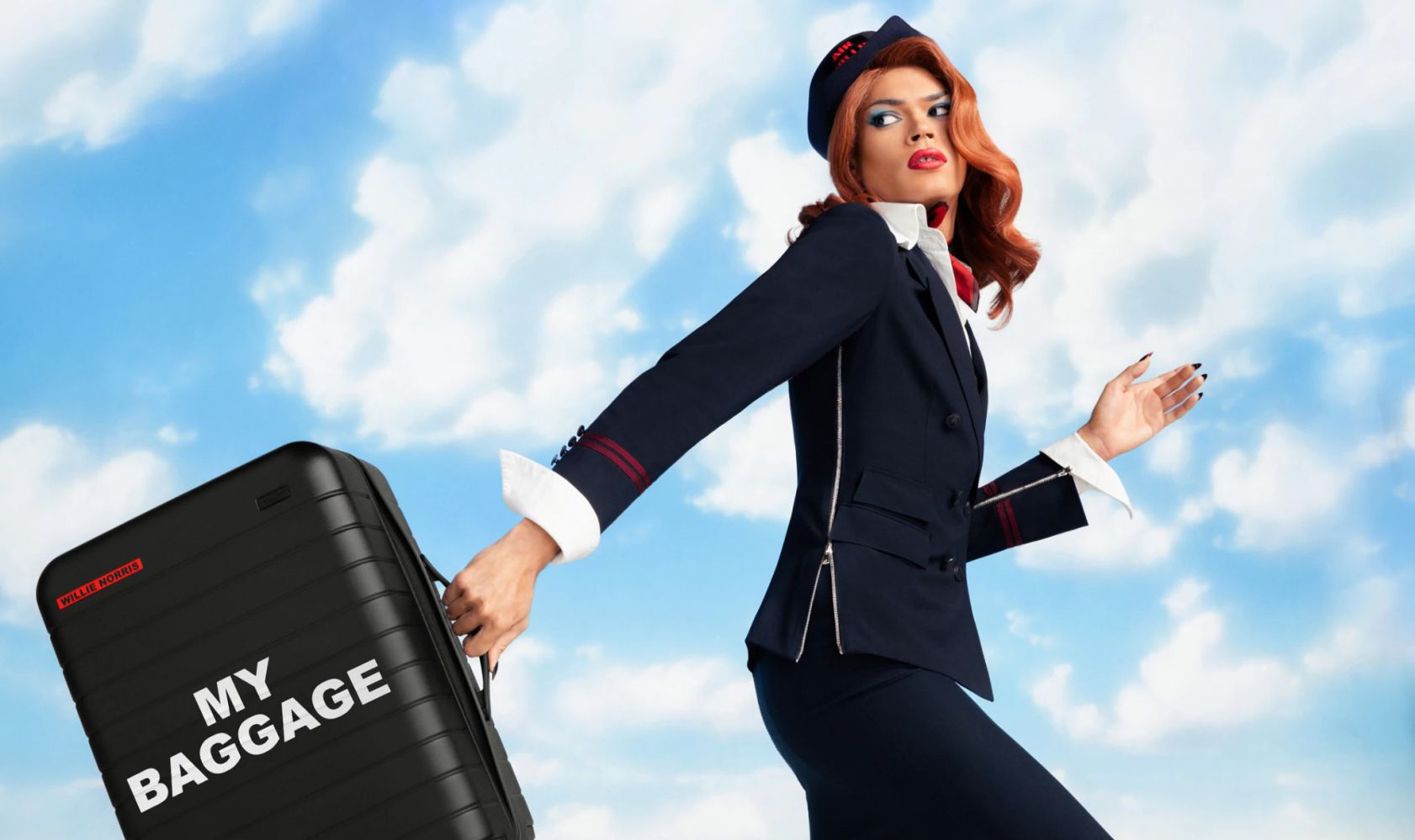 <p>Air Willie is prepared for take off.</p> <p>Fashion designer Willie Norris has partnered with the travel brand Away to launch a new collection of luggage on Thursday in honor of Pride Month, which begins June 1. Featuring the bold text her work is known for, the carry-ons and garment bags are decorated with witty statements like “Something to Declare” and “This Is Personal.”</p> <p>On designing the luggage, Norris told WWD she drew inspiration from air travel signage: “I wanted the products in this collaboration to simultaneously blend in and stand out at an airport, and look like they were signs of their own.”</p> <p>Though Norris referred to designing on luggage as a “dream blank canvas,” the format did come with some challenges. “Getting my signature bold type to translate properly onto the texture and divots of the Away suitcases was a challenge that the design team at Away handled with aplomb,” Norris explained.</p> <p>Proceeds from Norris’ collaboration with Away will go toward the International LGBTQ+ Travel Association Foundation, an organization advocating for safety and equality within LGBTQ+ tourism. Norris added that Away is a longtime supporter of IGLTA; the designer emphasized the importance of supporting the queer community beyond Pride Month.</p> <p>“Away’s mission to transform travel resonated deeply with me,” Norris said. “In a world where borders and boundaries can often feel limiting, Away’s ethos stands for openness and inclusivity. They understand that everyone’s journey is unique, and they strive to make traveling an empowering and positive experience for all.”</p> <p>This new collection follows Norris’ previous collaboration with Away, which included suitcases designed for members of the queer community traveling during Pride — however, they weren’t on sale for the general public. This year, the designs are on the market, with the Bigger Carry-On retailing for $295 and the Garment Bag available for $195.</p> <p>When it comes to jetting off, Norris offers succinct and sage advice: “Take it all in stride. Traveling is a privilege — be grateful for the ability to do it. Be nice to people. Eat well.”</p>