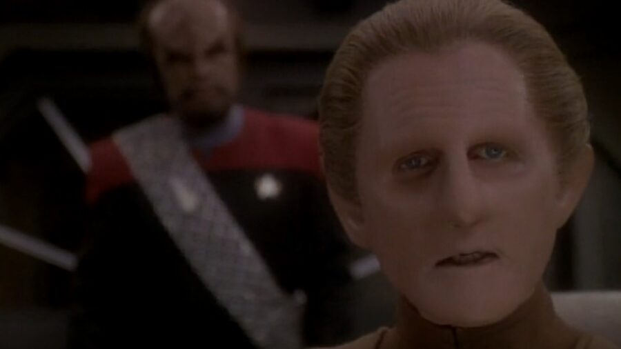 <p>The Season 4 Star Trek: Deep Space Nine episode “Hippocratic Oath” perfectly illustrates why Odo needed to be the franchise’s first detective. </p><p>As the third episode of Season 4, it takes place shortly after the arrival of Worf as a regular cast member, who finds it impossible to let go of his security chief instincts from his time on the Enterprise. </p><p>More direct in his time as security chief than Odo, Worf has a low opinion of how the Changeling does his job. </p><p>When Worf gets wind of Quark making an illicit deal, he assumes Odo isn’t doing anything about it. </p><p>The Klingon takes things into his own hands, and in doing so unintentionally ruins the Changeling’s long-brewing sting operation. </p><p>It’s the kind of investigation Star Trek: Deep Space Nine could have Odo doing on the regular, but that you would never see on TNG or Voyager. The crew of those ships combat smuggling on board by not allowing smugglers on board. DS9 can’t afford that luxury. </p>