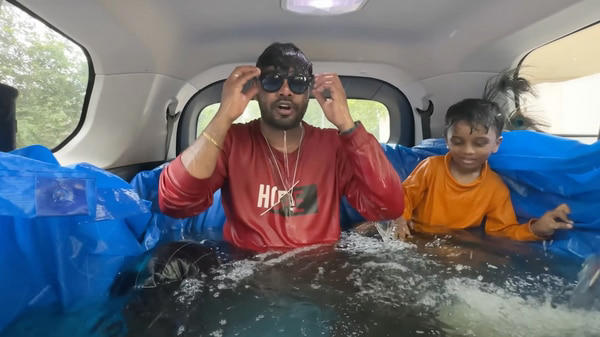 Screengrab from the viral YouTube video where an influencer was seen setting up a swimming pool inside his Tata Safari SUV. The Motor Vehicle Department took stringent action by suspending the registration of the vehicle.