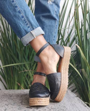 model wearing the black sandals