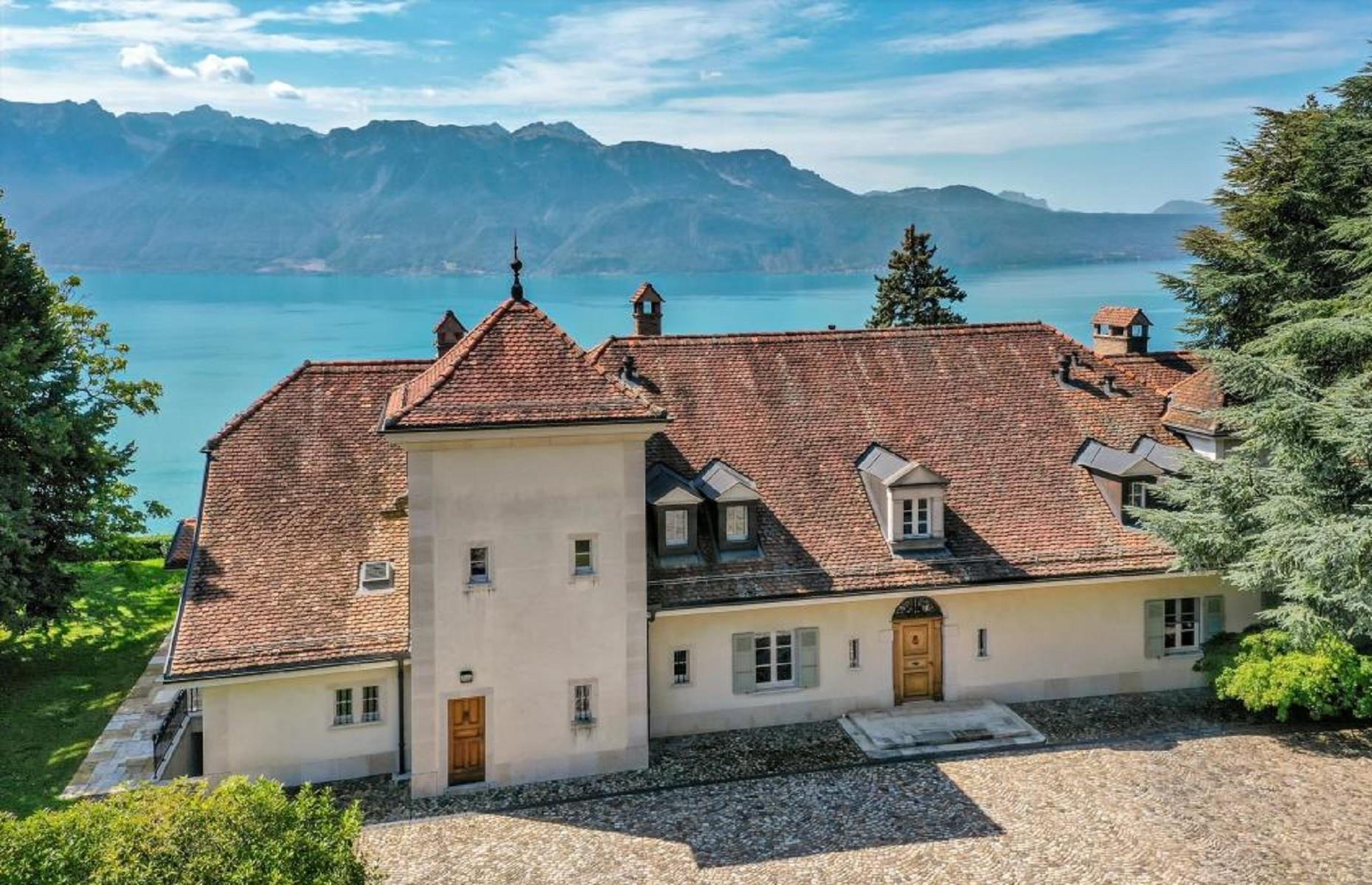 <p>With all the charm, space and style of a historic castle, this gorgeous property was built in 1996, yet it looks like it's been on this idyllic lake-side plot in Switzerland for centuries.</p>  <p>Described by Knight Frank as a "stupendous 14-room mansion", the residence is situated in Chexbres, a Swiss village known for its vineyards, and enjoys 180-degree views of Lake Geneva. </p>