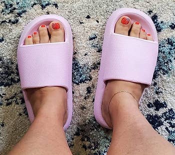 reviewer wearing the lavender sandals