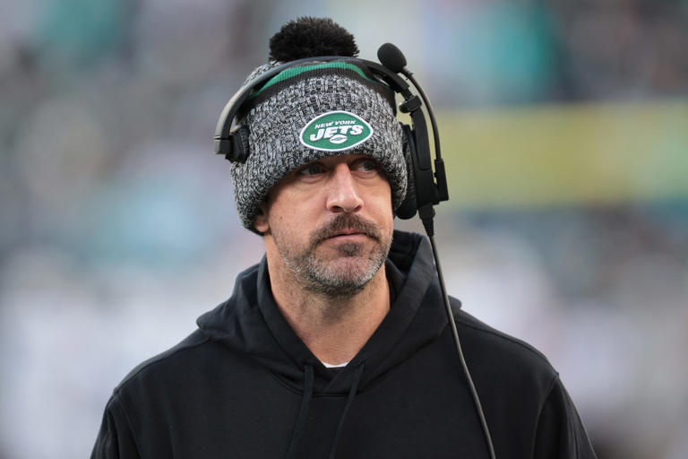 New York Jets quarterback Aaron Rodgers (8) on the sidelines during the first half against the Miami Dolphins at MetLife Stadium. Mandatory Credit: Vincent Carchietta-USA TODAY Sports
