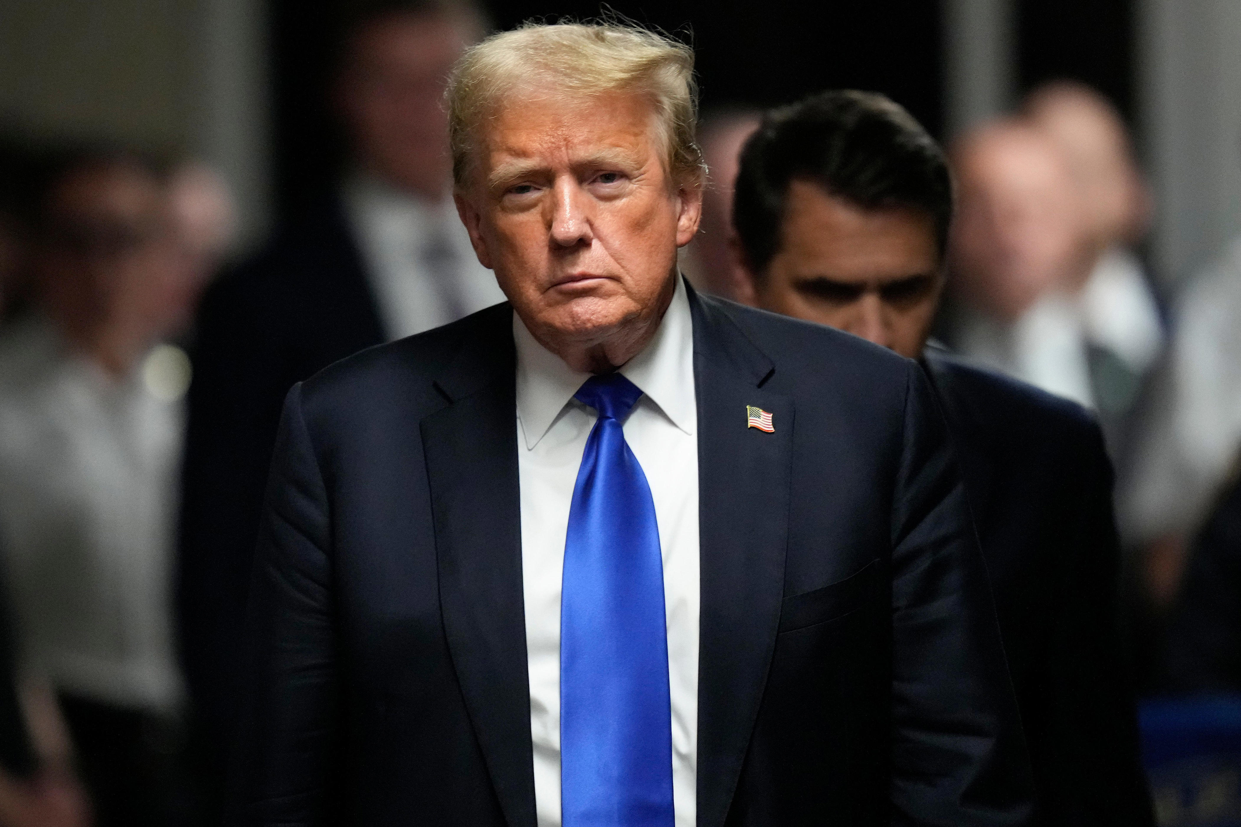 Former President Donald Trump walks to speak to the media on May 30, 2024, following his hush money trial in New York, where he was found guilty on all 34 felony counts of falsifying business records in the first of his criminal cases to go to trial.