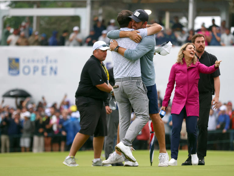 TORONTO, ONTARIO - JUNE 11: Nick Taylor of Canada is congratulated by Corey Conners of Canada after winning the RBC Canadian Open in 4 playoff holes at Oakdale Golf & Country Club on June 11, 2023 in Toronto, Ontario. (Photo by Vaughn Ridley/Getty Images)