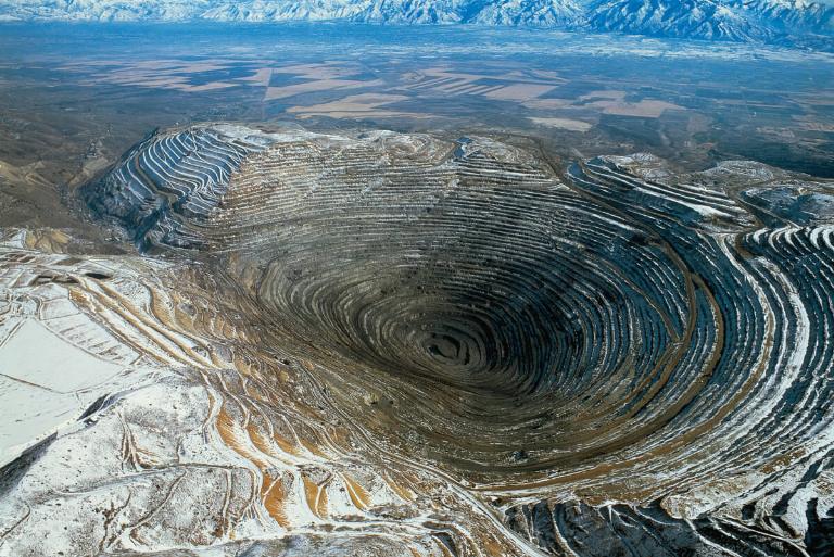 <p>The Bingham Canton Mine found in Utah is the world's largest copper mine. It's over 100 years old and has a 2.5-mile wide pit in the Oquirrh Mountains. It is considered the largest human-made excavation thanks to it reaching 0.75 miles deep and expanding over 1,900 acres.</p> <p>If you're wondering where we source a good portion of our copper, wonder no longer. An incredible 17 million tons of copper are sourced right here! On top of that, 23 million ounces of gold and 190 million ounces of silver also originated from this mine.</p>